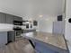 Modern kitchen featuring stainless steel appliances, gray cabinets, and a spacious center island at 927 E 7Th Ave, Broomfield, CO 80020