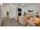 Cozy living room featuring a stone fireplace, plush seating, and modern decor for relaxation at 927 E 7Th Ave, Broomfield, CO 80020