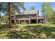 Expansive backyard with a multi-level deck perfect for entertaining and enjoying the outdoors at 1570 Blakcomb Ct, Evergreen, CO 80439