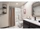 Well-lit bathroom with a glass-enclosed shower, elegant vanity, and modern fixtures at 1570 Blakcomb Ct, Evergreen, CO 80439
