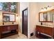 Bathroom has dual sinks with granite countertops, tile backsplash, and wood cabinets at 1570 Blakcomb Ct, Evergreen, CO 80439