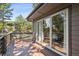 Spacious deck with dark wood and sliding glass doors leading to the home interior at 1570 Blakcomb Ct, Evergreen, CO 80439