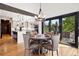Open dining area connects to the kitchen and features a view to the deck with sliding glass doors at 1570 Blakcomb Ct, Evergreen, CO 80439