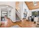 Open living space with high vaulted ceilings, fireplace, and hardwood floors at 1570 Blakcomb Ct, Evergreen, CO 80439