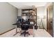 This office features natural light, neutral walls, carpet flooring, and a modern desk setup at 1570 Blakcomb Ct, Evergreen, CO 80439