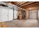 An unfinished basement area with exposed utilities, concrete floors, and white walls at 9522 Silver Spur Ln, Highlands Ranch, CO 80130