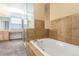 Bathroom area with a bathtub, a separate glass shower, and and vanity at 9522 Silver Spur Ln, Highlands Ranch, CO 80130