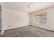 Bedroom with neutral walls and carpet, and a window offering natural light at 9522 Silver Spur Ln, Highlands Ranch, CO 80130