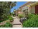 A well maintained walkway with shrubs and landscaping leads to the charming house at 9522 Silver Spur Ln, Highlands Ranch, CO 80130