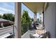 Relaxing balcony area with comfortable seating, grill, and a peaceful view of the surrounding neighborhood at 2197 S Clermont St, Denver, CO 80222