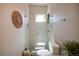 Bright bathroom features a glass-enclosed shower, complemented by modern fixtures and a large sink at 2197 S Clermont St, Denver, CO 80222