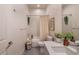 Bright bathroom features tiled shower and tub combination, complemented by modern fixtures and stylish decor at 2197 S Clermont St, Denver, CO 80222