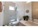 Bright bathroom features a glass-enclosed shower, complemented by modern fixtures and stylish decor at 2197 S Clermont St, Denver, CO 80222