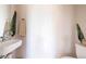 Bright bathroom featuring a modern sink, minimalist decor, and a clean, neutral color palette at 2197 S Clermont St, Denver, CO 80222
