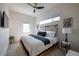 This bedroom boasts ample natural light, complemented by neutral tones and a modern ceiling fan at 2197 S Clermont St, Denver, CO 80222