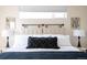 Comfortable bedroom features a stylish headboard, chic bedside tables and modern artwork at 2197 S Clermont St, Denver, CO 80222
