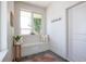 Bright entryway featuring a built-in bench, a welcome sign, and decorative accents at 2197 S Clermont St, Denver, CO 80222