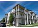 Contemporary three-story condo building featuring private balconies and modern architectural details at 2197 S Clermont St, Denver, CO 80222