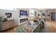 Open concept living room flows into a modern kitchen with stainless steel appliances and bar seating at 2197 S Clermont St, Denver, CO 80222