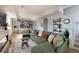 Spacious living room features a comfortable sectional sofa, kitchen, and stylish decor at 2197 S Clermont St, Denver, CO 80222