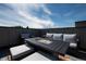 Enjoy the outdoors on this rooftop deck, furnished with comfortable seating around a modern fire table at 2197 S Clermont St, Denver, CO 80222