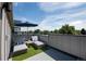 Enjoy the rooftop deck with modern lounge chairs, an umbrella, and beautiful surrounding views at 2197 S Clermont St, Denver, CO 80222