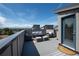 Rooftop deck with cozy seating around a modern fire table offers scenic views and a perfect place to relax at 2197 S Clermont St, Denver, CO 80222
