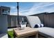Perfect rooftop deck setup for lounging in the sun with beverages and plush chaise lounge seating at 2197 S Clermont St, Denver, CO 80222