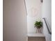 Stylish stairway landing with neutral carpet and decorative accent to give the home a warm feel at 2197 S Clermont St, Denver, CO 80222