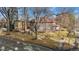 Two story home with a large yard and tree-lined street at 1650 Monaco St Pkwy, Denver, CO 80220