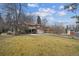 Aerial view of house, yard, and detached garage at 1650 Monaco St Pkwy, Denver, CO 80220