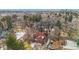 Aerial view of a house with a large yard and city view at 1650 Monaco St Pkwy, Denver, CO 80220