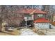 Backyard patio with seating, perfect for relaxing or entertaining outdoors in this charming brick home at 1650 Monaco St Pkwy, Denver, CO 80220