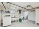 Basement laundry area with washer, dryer, and utility sink at 1650 Monaco St Pkwy, Denver, CO 80220