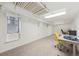 Finished basement with painted ceiling, carpet and an office area at 1650 Monaco St Pkwy, Denver, CO 80220
