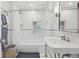 Classic bathroom with subway tile and pedestal sink at 1650 Monaco St Pkwy, Denver, CO 80220