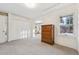 Bedroom with built-in closet and window offering natural light at 1650 Monaco St Pkwy, Denver, CO 80220