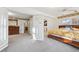 Bright bedroom featuring unique folding glass doors, ensuite bathroom, and a walk-in closet at 1650 Monaco St Pkwy, Denver, CO 80220