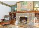 Fireplace with tiled surround and decorative mantle at 1650 Monaco St Pkwy, Denver, CO 80220