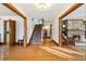 Inviting foyer with hardwood floors and a staircase leading to the upper level at 1650 Monaco St Pkwy, Denver, CO 80220