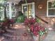 Brick front steps with landscaping and welcoming entrance at 1650 Monaco St Pkwy, Denver, CO 80220