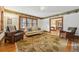Cozy living room with hardwood floors, a decorative rug, and comfortable seating at 1650 Monaco St Pkwy, Denver, CO 80220