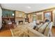 Living room with hardwood floors, fireplace and built-in shelves at 1650 Monaco St Pkwy, Denver, CO 80220