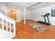 Spacious basement area featuring hardwood floors and a treadmill at 6468 S Hudson St, Centennial, CO 80121