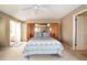 Serene bedroom with a large bed, access to balcony, and ample natural light at 6468 S Hudson St, Centennial, CO 80121