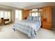 Bright bedroom with integrated storage, natural light, and access to a balcony at 6468 S Hudson St, Centennial, CO 80121