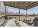 Cozy back deck featuring a picnic table, outdoor seating, and a grill, perfect for entertaining and enjoying backyard views at 21562 Omaha Ave, Parker, CO 80138
