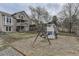 Backyard featuring a wooden playset, a swing, a slide, and plenty of space for play and relaxation at 21562 Omaha Ave, Parker, CO 80138