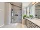 Well lit bathroom with glass walk in shower and glass block window for added light at 21562 Omaha Ave, Parker, CO 80138
