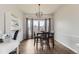 Cozy dining room with large windows, and seating for four offers an intimate setting at 21562 Omaha Ave, Parker, CO 80138